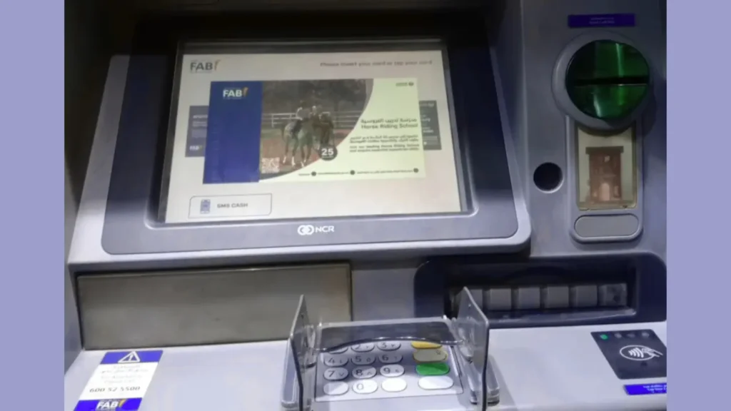 "FAB ATM machine interface showing card slot, keypad, and welcome screen"